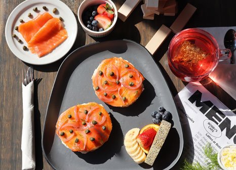 Smoked salmon bagels with fresh fruit and a berry drink at Bobby's Breakfast Cafe & Bar in Toronto